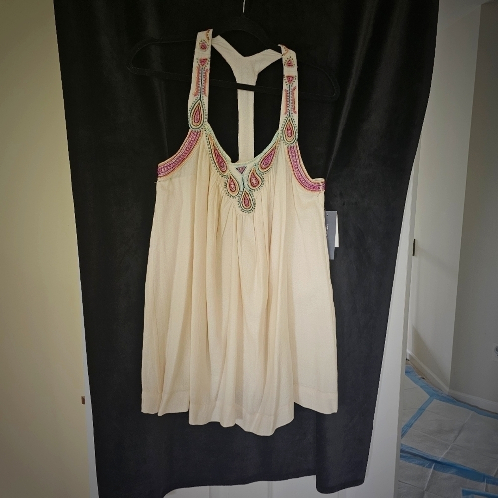 Cream colored beaded and embroidered swing blouse